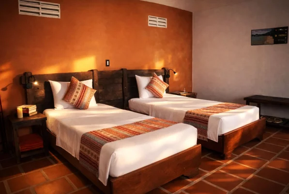 - Welcome to Whale Island resort Warm brown accommodation with wooden interiors and terracotta details inspired by ancient Cham Pa architecture